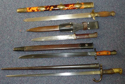 Lot 132 - A Chinese Sword, with 42cm double edge steel blade, brass crossguard and mounts to the ribbed...