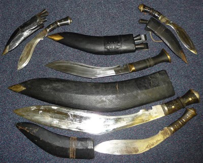 Lot 150 - A Large Indian Kukri, with black leather scabbard; four Other Smaller Kukri, with leather...