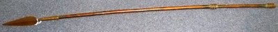 Lot 181 - A West African Spear, with leaf shape blade and socket on a long wood haft with coiled steel...