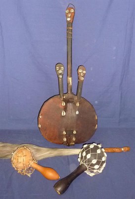 Lot 188 - An African Stringed Musical Instrument, with gourd belly and skin drum, two masked struts and...