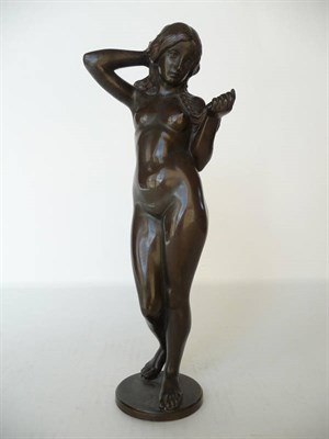 Lot 1179 - An Art Nouveau Bronze of a Nude Maiden, with one arm behind her head and the other arm playing with