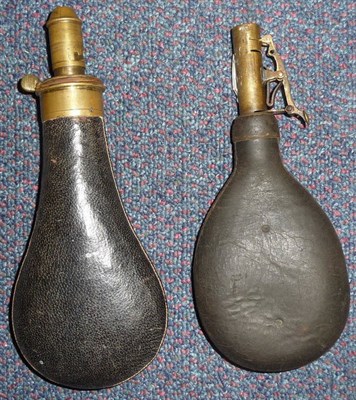 Lot 226 - A Snider Leather-Covered Powder Flask, with brass charger; a Leather Shot Flask, with brass nozzle.