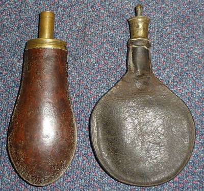 Lot 227 - A Brown Patinated Steel Powder Flask, of flattened bag shape, with brass charger and pull-off...