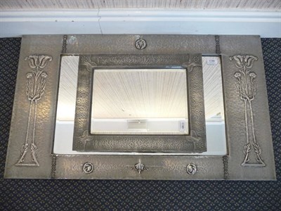 Lot 1190 - An Arts and Crafts Rectangular Pewter Mirror, the sides embossed with a stylised flower,...