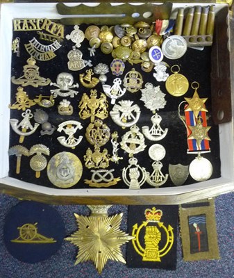 Lot 72 - A Quantity of Militaria, including twenty two cap badges and shoulder titles, various buttons,...