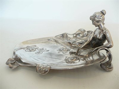 Lot 1195 - A WMF Silvered Metal Figural Visiting Card Tray, Model No.229, cast with a maiden with arm...