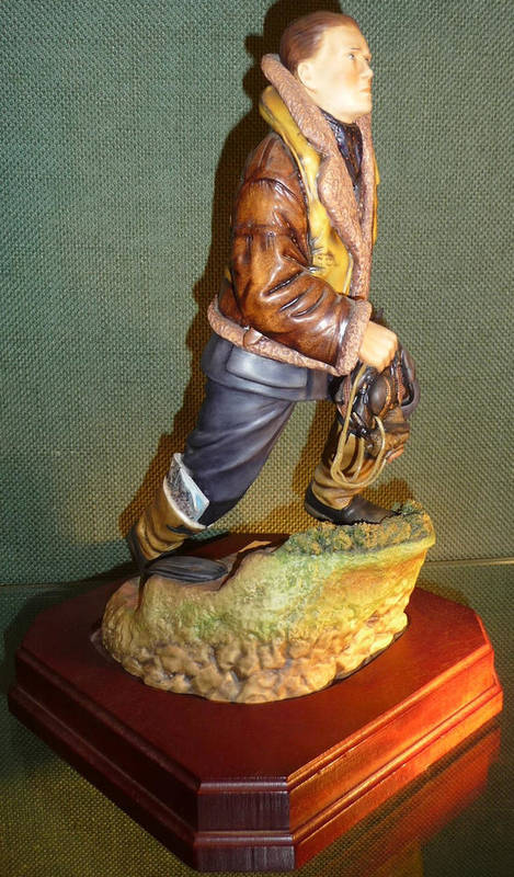 Lot 93 - An Ashmor Porcelain Figure of a Royal Air Force Fighter Pilot of Churchill's Few, limited...