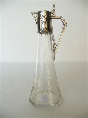 Lot 1196 - A WMF Jugenstil Claret Jug, clear cut glass body, with silver plated mounts, stamped WMF, 20.5cm