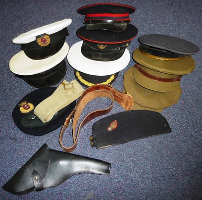 Lot 131 - A Collection of Military Hats, comprising a peaked cap to the Loyal Regiment, a Merchant Navy...