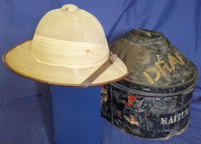 Lot 135 - A British Officer's Wolseley Tropical Pith Helmet, in khaki, with eight band pugaree set with a red