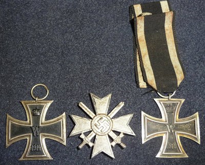Lot 142 - Two 1914 German Iron Crosses, Second Class, and a Third Reich Cross with Swords, First Class,...