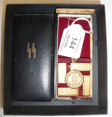 Lot 144 - A German Third Reich SS 25 Year Long Service Gold Cross, with teardrop form suspension loop....