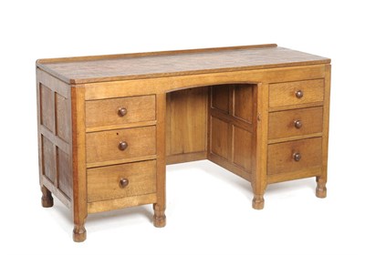 Lot 1203 - A Robert "Mouseman" Thompson Panelled Oak Kneehole Dressing Table, with raised upstand above...