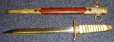 Lot 178 - A Second World War Japanese Naval Dirk, the 21cm single edge steel blade with a narrow fuller...