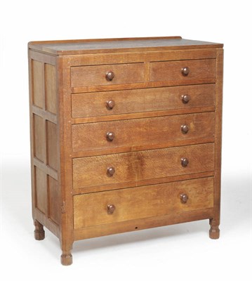 Lot 1204 - A Robert "Mouseman" Thompson Panelled Oak Chest of Drawers, with raised upstand above two short...