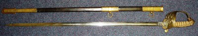 Lot 196 - A Royal Naval Reserve Sword, the 80cm single edge fullered steel blade etched with crowned...