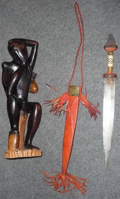 Lot 257 - A North African Sword, with double edge steel blade, leather bound grip and blade pommel, the...