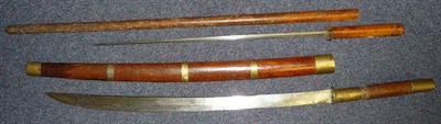 Lot 261 - A Burmese Dha,  with 58.5cm single edge steel blade, brass mounted wood grip stamped B.O.C.,...