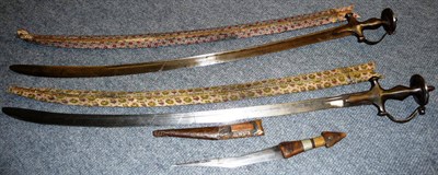 Lot 285 - An Indian Talwar, the single edge steel blade with two narrow fullers to each side, steel hilt with