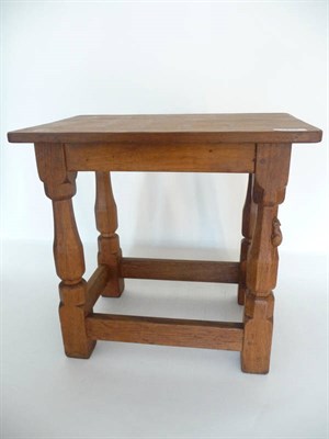 Lot 1215 - A Robert "Mouseman" Thompson Oak Stool, with solid seat, on four octagonal legs joined by a...