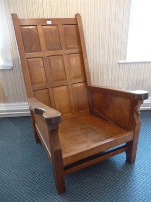 Lot 1216 - A Robert "Mouseman" Thompson Oak Smoker's Chair, with panelled back, shaped arm rests, with...