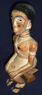 Lot 302 - A Fante, Ghana Carved Light Wood Figure, as a woman with traces of white pigmentation and black...