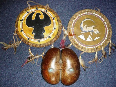 Lot 308 - A Coco de Mer Nut, one side cut and half hinged to form a box;  two North American Indian Hide Drum