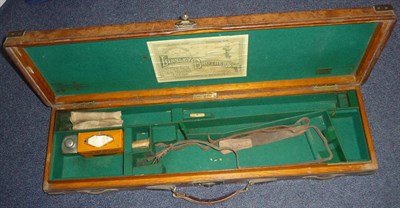 Lot 339 - A Brass bound Stitched Leather Shotgun Case by Linsley Brothers, Leeds, the green baize and oak...