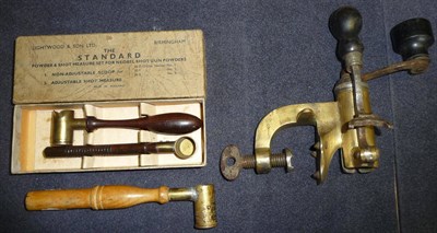 Lot 347 - A Brass 12 Bore Roll Turn-over Tool, with ebony handles, stamped NJ 7007 12; a Brass Adjustable...