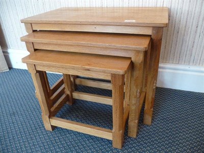 Lot 1222 - A Robert "Mouseman" Thompson Oak Nest of Tables, on four octagonal legs, each with carved mouse...