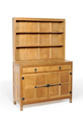 Lot 1225 - A Robert "Mouseman" Thompson 4'  Oak Welsh Dresser, the open delft rack with two fixed shelves...