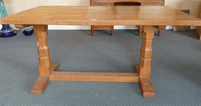 Lot 1226 - A Robert "Mouseman" Thompson 5' Oak Refectory Table, on two octagonal legs joined by a stretcher at