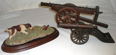 Lot 414 - A Bronzed Cast Iron Small Model Signal Cannon, with ring turned barrel, on an iron carriage,...