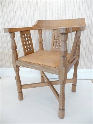 Lot 1230 - A Robert "Mouseman" Thompson Oak Monk's Chair, curved back with shaped arms over three lattice...