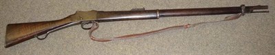 Lot 462 - A Mark IV Martini-Henry Enfield Rifle, the 82.5cm two band steel barrel with hinged ladder...