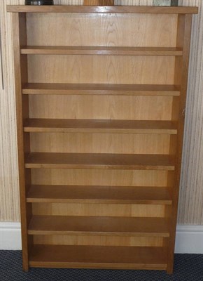 Lot 1238 - A Robert "Mouseman" Thompson Oak Compact Disc Bookcase, with over hanging top above seven fixed...