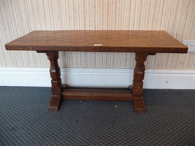 Lot 1239 - A Robert "Mouseman" Thompson Oak Rectangular Coffee Table, on two octagonal legs joined by a...