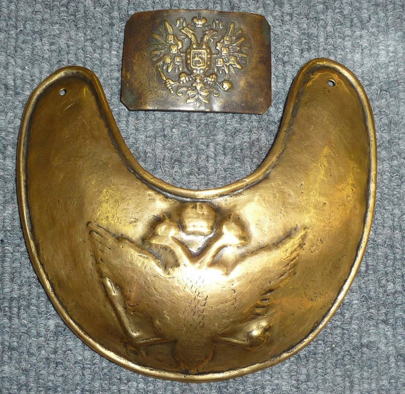 Lot 102 - A 19th Century Russian Brass Gorget, embossed with the Russian two headed eagle, with rolled...