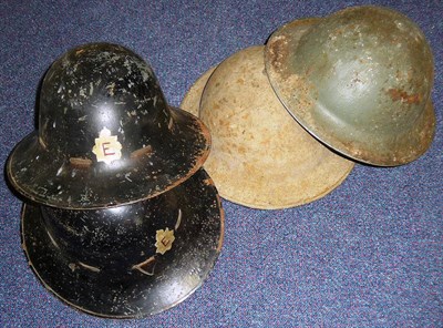 Lot 128 - Two Second World War British Zuckerman Civil Defence Helmets, painted black, each with a silver...