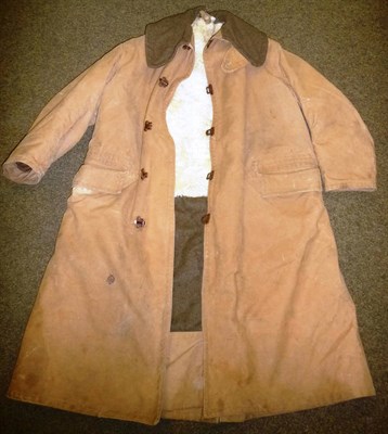 Lot 143 - A British Second World War Military Issue Khaki Gaberdine Coat, with sheepskin lining, green...