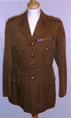 Lot 145 - A Second World War Number 2 Dress Khaki Jacket, to a Captain of the Royal Artillery, with brass...