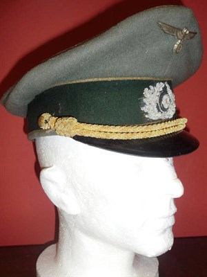 Lot 151 - A German Third Reich General's Peaked Cap, in field grey wool with green wool hat band, gilt...