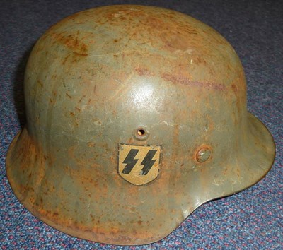 Lot 161 - A German Third Reich M42 Helmet, painted green, with single SS decal, aluminium and leather...