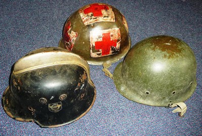 Lot 165 - A German Third Reich Fire Police Helmet, painted black, with white metal comb, lacks liner; a...