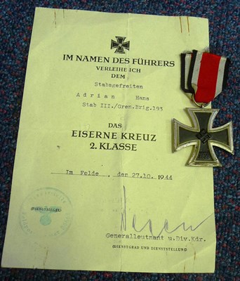 Lot 169 - A Second World War German Iron Cross, Second Class, with  ribbon and citation to Stabsgefreiten...