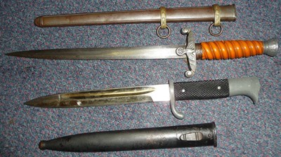 Lot 180 - A German Third Reich Army Officer's Dagger, the double edge steel blade unmarked, the hilt with...