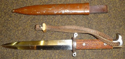 Lot 184 - A German Dress Dagger, the double edge steel blade with medial ridge, steel recurving...