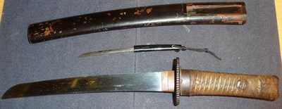 Lot 202 - A Late 19th Century Japanese Wakizashi, the 25cm steel blade with delamination marks, signed on the