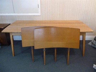 Lot 1255 - An Edward Barnsley Oak Extending Dining Table, made by C Bray, the five plank top on four chamfered