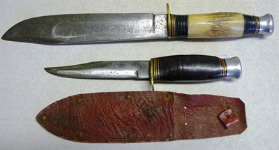 Lot 238 - A Bowie Knife, with hatchet tip steel blade, the compressed coiled leather and antler grip with...